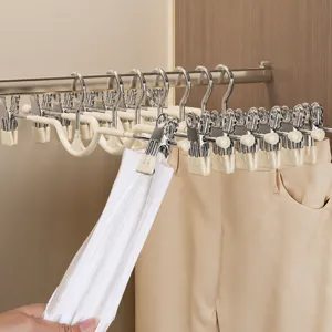 Multi-clip trouser hanger for closet organization and skirt storage with anti-slip design.