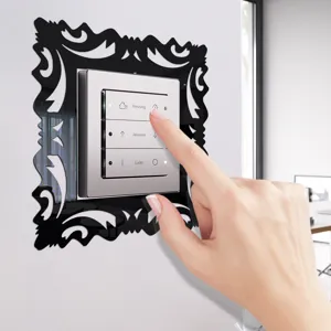 Close-up detail of the acrylic mirror switch wall sticker frame in a modern room setup.