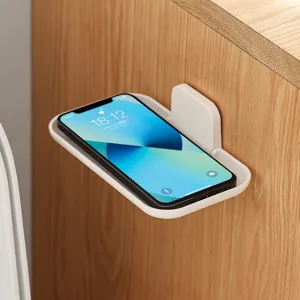 Wall-mounted foldable storage rack punch-free phone and glasses holder for bathroom and desk.