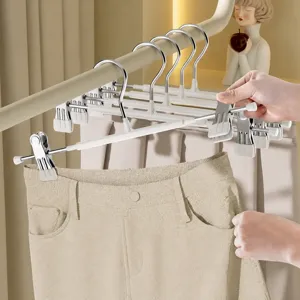 Stainless steel pants hangers with soft rubber clips, non-slip skirt clothes storage.
