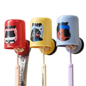 Wall-mounted suction toothbrush holder with inverted cup, colorful bathroom organizer.
