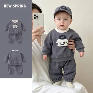 Detail view of baby boy grey two-piece sweatshirt and sweatpants set with cute dog applique