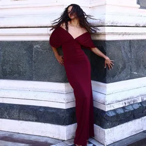 Elegant burgundy off-shoulder maxi dress with deep V-neck and ruched sleeves detail view