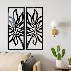 Scene detail of black 3D acrylic mirror leaf wall sticker mounted on living room wall.