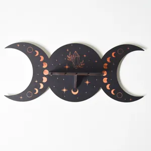 Wooden boho moon phase crystal wall shelf detail, black and copper wall hanging decor.