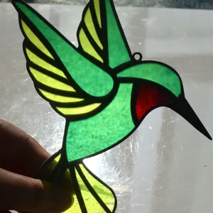 Stained glass hummingbird suncatcher acrylic window hanging ornament for home decor.