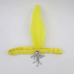 1920s vintage yellow feather headband with silver beaded tassel for Gatsby party costume.
