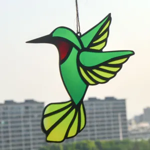 Stained glass hummingbird suncatcher window hanging pendant, vibrant green bird decor.