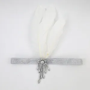 Vintage 1920s flapper feather headband silver beaded hair accessory for party costume.