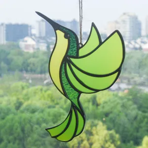 Hummingbird suncatcher detail, stained glass hanging window ornament with vibrant green tones.