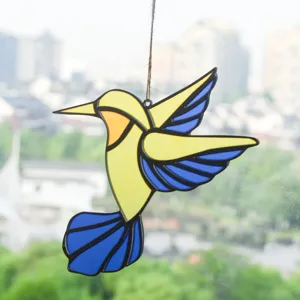 Stained acrylic hummingbird window hanging sun catcher detail view showing vibrant blue and yellow.