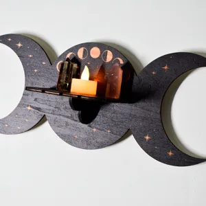 Close up detail view of the triple moon wooden wall shelf with Wiccan moon phase print.