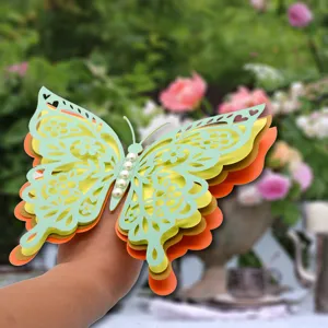Close-up view of the 3D multi-layered hollow paper butterfly detail with pearls.