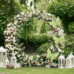 Large 3D hollow butterfly wall sticker and floral arch scene decoration for weddings and parties.