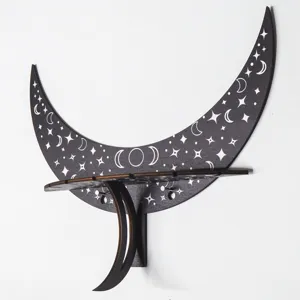 Detailed view of bohemian moon wall shelf, dark wood celestial decor for room storage.