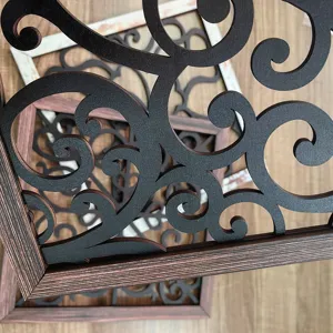 Wooden hollow wall decor panel with carved scroll pattern, stylish home mural for living room.