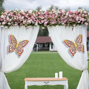 Large 3D hollow butterfly wall stickers made of pearlescent paper for wedding decor.