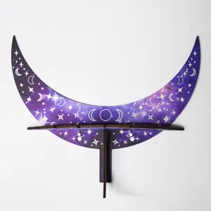 Detailed view of the wooden crescent moon wall shelf with galaxy star and moon phases print.