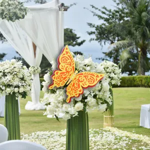 Detail view of large 3D hollow colorful pearl paper butterfly decoration for wedding party.