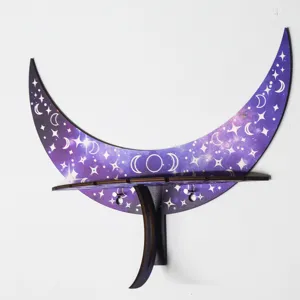 Wooden crescent moon wall shelf with celestial star print for bohemian room decor and display.