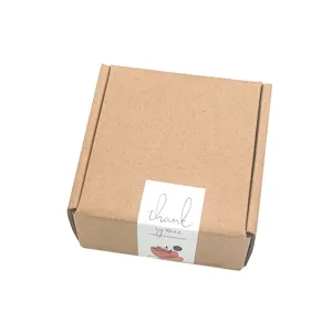 Caja de embalaje de papel kraft marrón con pegatina de sello de agradecimiento segura