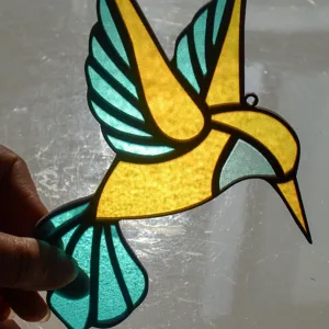 Stained glass hummingbird suncatcher acrylic hanging ornament, vibrant detail view.