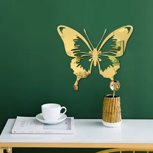 Gold acrylic mirror butterfly wall sticker, 3D hollow decorative decal for home decor.