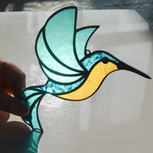 Colibri sun catcher detail shot, stained glass style acrylic hanging ornament decoration.