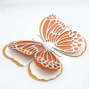 Detailed shot of 3D 4-layer hollow pearl paper butterfly wall sticker for wedding decor.