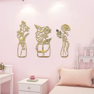 3D gold acrylic mirror potted plant wall stickers, self-adhesive flower vase decor detail.