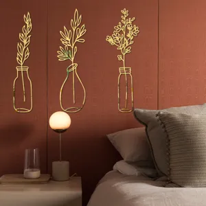 Detail view of 3D gold acrylic mirror wall stickers featuring floral and vase designs in bedroom.