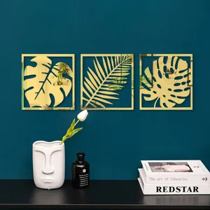 Stickers muraux miroir acrylique 3D dorés avec motifs de feuilles tropicales pour déco.