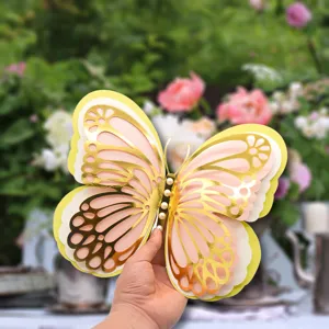 Close-up detail of 3d layered hollow paper butterfly wall sticker with elegant pearl decorations.