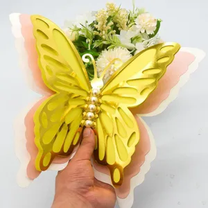 Close-up detail of 3D hollow butterfly wall sticker with pearlescent layered paper and pearls.