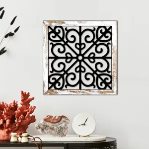 Wooden hollow wall art detail, black scroll pattern and rustic wood frame for interior decor.