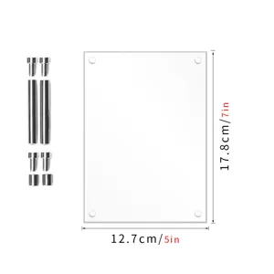 Clear acrylic photo frame detail showing transparent double layer panel and metal standoff screws.