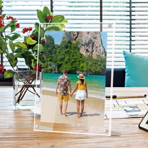 Clear double layer acrylic photo frame desktop picture display stand with metal support legs.