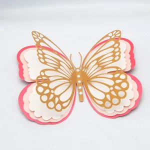 Close-up detail of 3D multi-layer hollow butterfly wall sticker with pearl decor.