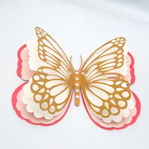 Close-up detail shot of multi-layer hollow paper butterfly wall sticker with pearls.