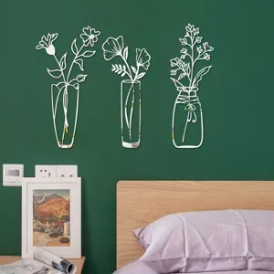 Close-up detail of 3D acrylic mirror wall stickers with floral vase designs for modern home decor.