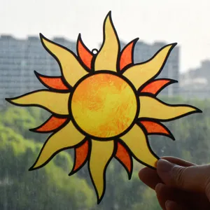 Stained glass sun suncatcher detail view, vibrant yellow orange acrylic hanging ornament decor