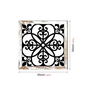 Wooden hollow wall decor with black and white carved pattern and rustic white wood frame.
