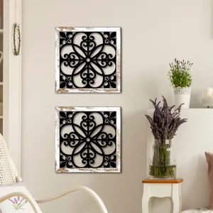 Wooden hollow wall decor detail showing vintage white frame and elegant black scroll art inside.