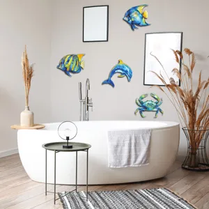 Ocean metal wall art detail view, featuring colorful fish, dolphin and crab for home decor.