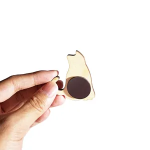 Close-up detail view of the wooden cat refrigerator magnet showing the magnetic design.