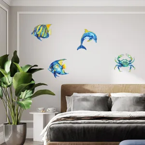 Detailed view of metal ocean animal wall art featuring dolphins and fish in a bedroom.