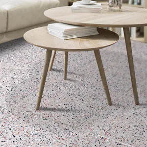Detailed view of terrazzo floor sticker in modern living room scene with wooden tables.