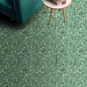 Green terrazzo floor tile sticker detail showing textured surface in a modern interior setting.