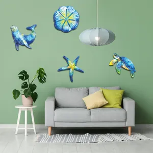 Metal ocean wall art hanging in living room, featuring cute marine animal designs for decor.