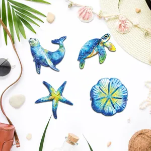 Detailed view of metal marine animal wall art set featuring seal, turtle, starfish, blue finish.